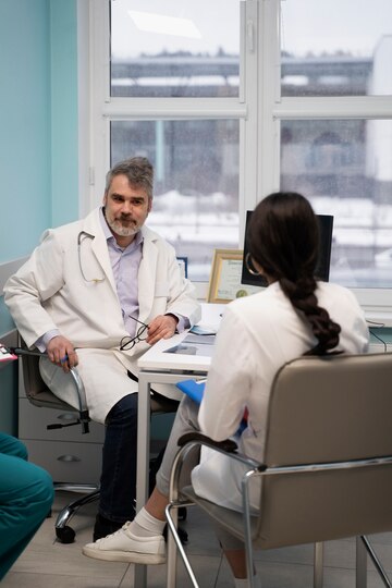 doctor talking to young woman