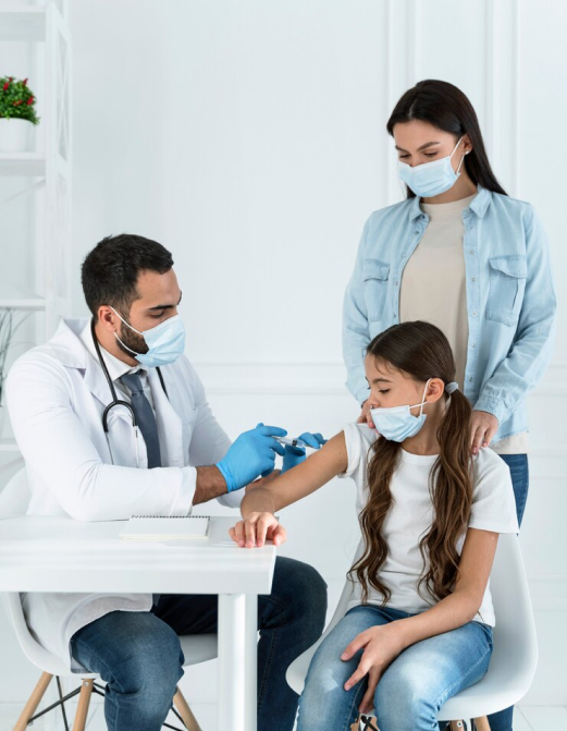 doctor vaccinating little girl with her mother