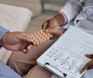 doctor giving medicine to patient