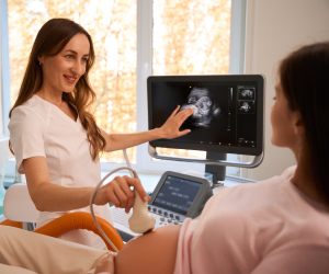 nurse showing an ultrasound of the patient