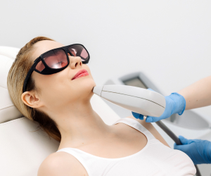 woman having a laser hair removal procedure in a clinic