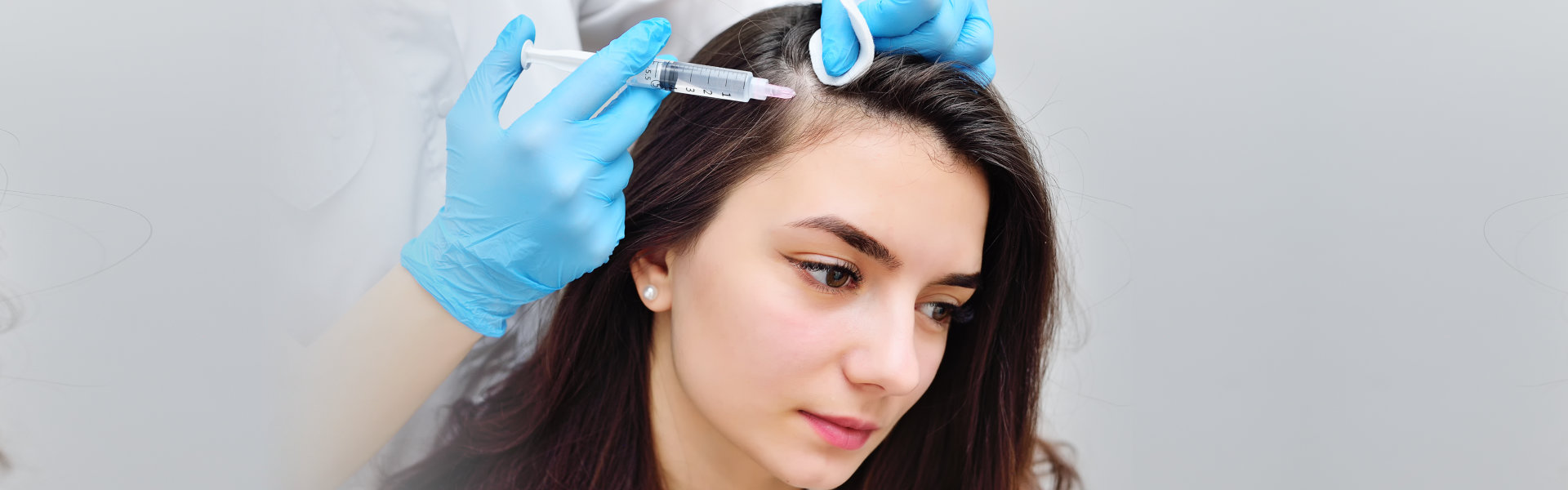 doctor injecting a woman's head