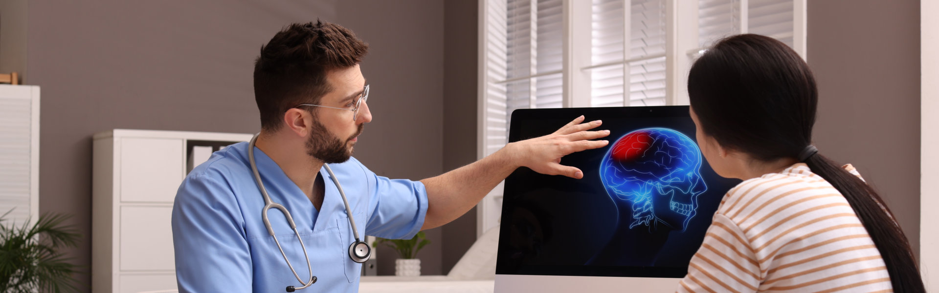 doctor showing brain scan to patient