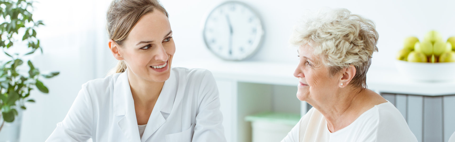 doctor smiling to elderly woman