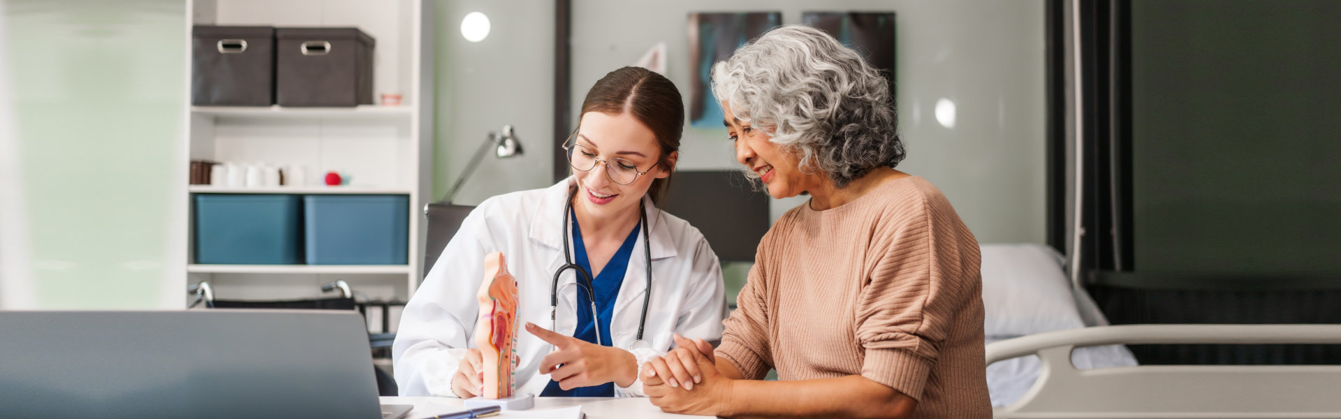 doctor talking to elderly patient