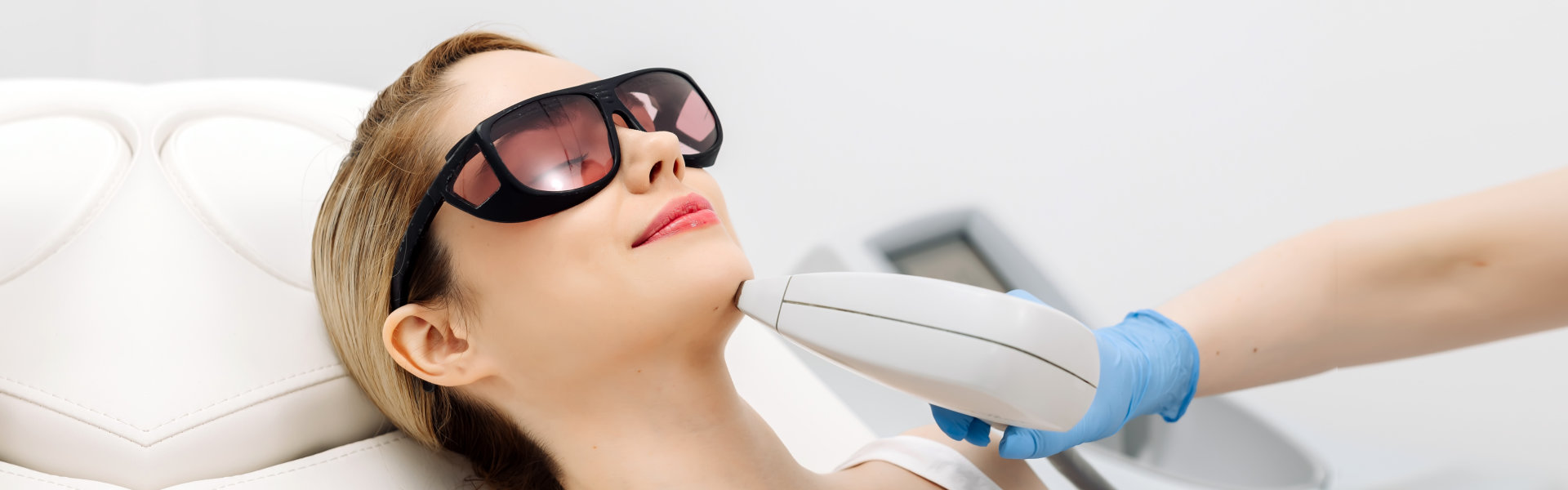 woman having a laser hair removal procedure in a clinic