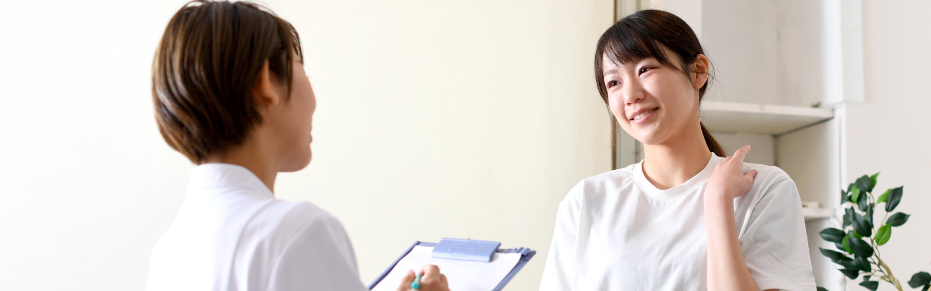 young woman consulting to professional doctor